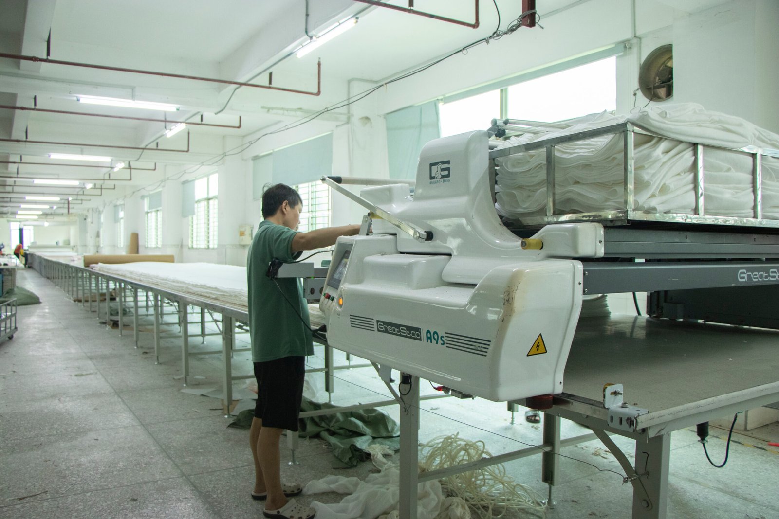 Cutting Costs Without Sacrificing Quality alt with keywords: A designer's hand adjusting a small trim on a bra