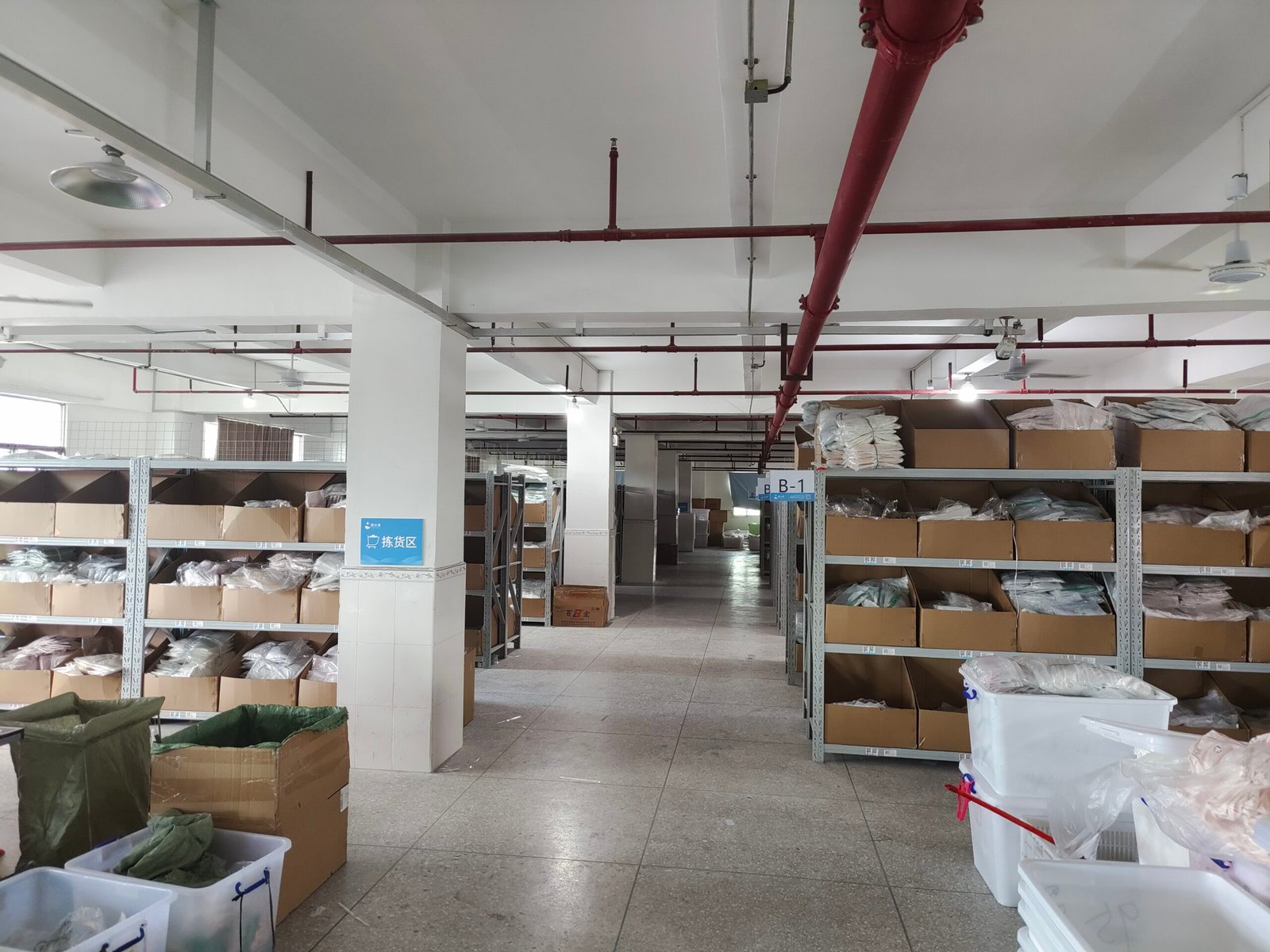 Lingerie Inventory Planning Tactics alt with keywords: A warehouse with neatly organized boxes of lingerie inventory