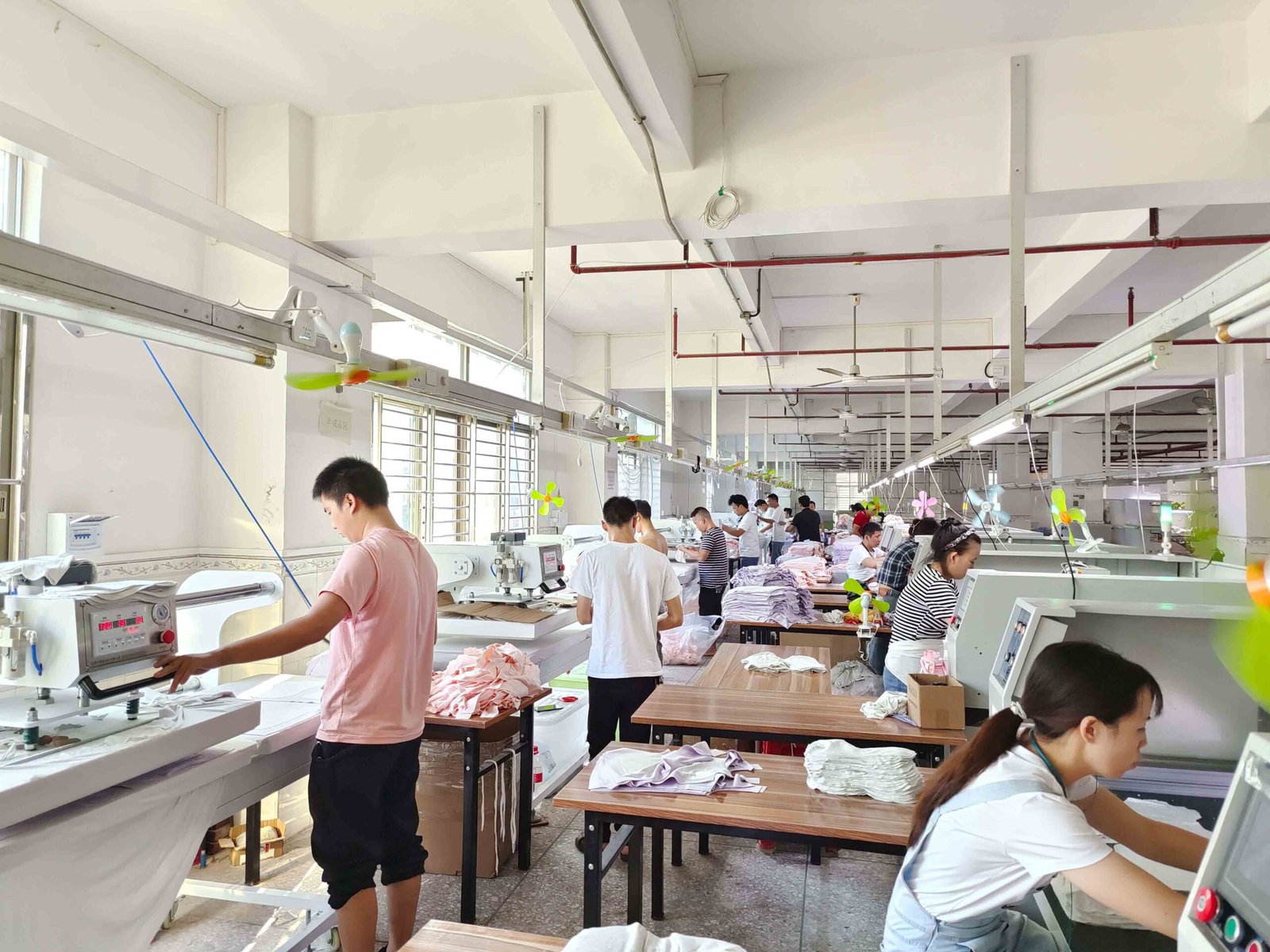 Evaluating a Bra Manufacturer's Production Capacity alt with keywords: A busy and organized sewing floor in a large bra manufacturing factory