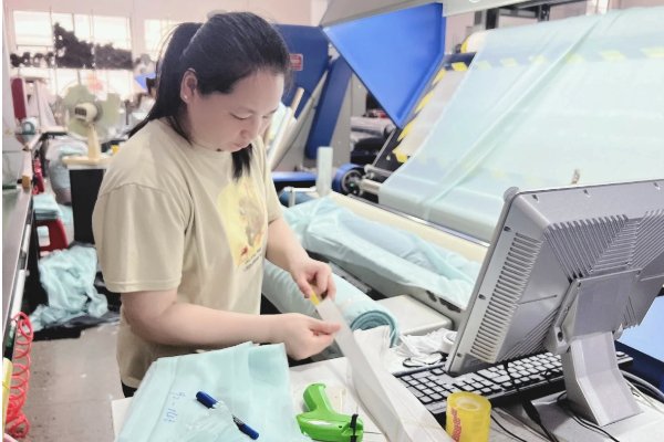 Undergarment quality inspection process Inspector checking a garment with a checklist