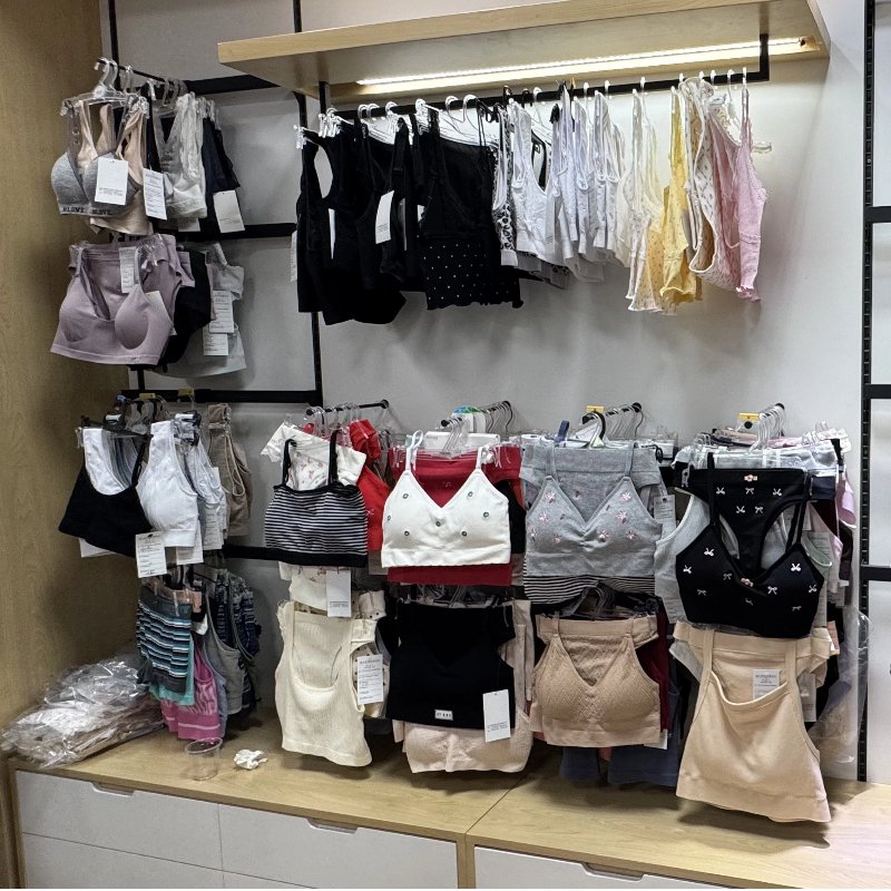 B2B Demand for Seamless Styles alt with keywords: A successful B2B buyer reviewing a profitable line of seamless underwear styles