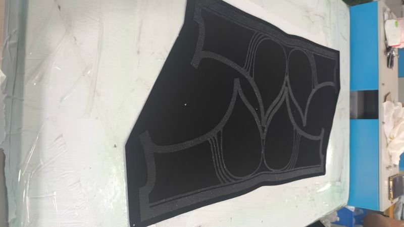 A cut panel with adhesive applied