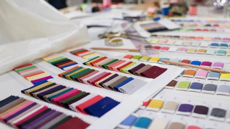 Multiple fabric color swatches used for lingerie material selection and custom color development.